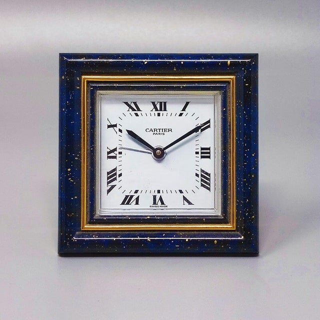 1980s gorgeous cartier alarm clock pendulette. Made in swiss. it's lapis lazuli and golden metal with manual winding....