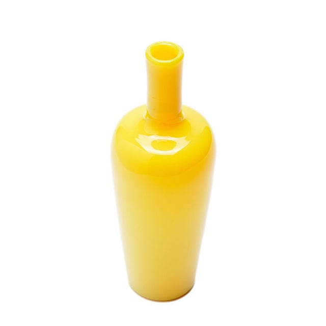 Mid Century blown cadmium yellow glass bar bottle. Murano, Italy, circa 1950.