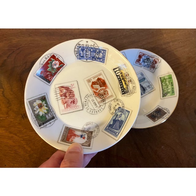 Pair Mid-Century Modern Richard Ginori Italian porcelain dishes decorated with world postage stamps. Measure 5 1/2"...