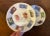 Pair Mid-Century Modern Richard Ginori Italian porcelain dishes decorated with world postage stamps. Measure 5 1/2"...