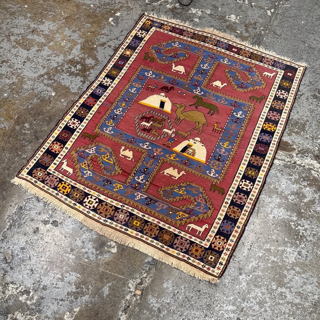 Design Plus Gallery presents a 3ft 11in × 5ft 3in Azerbaijani Kilim Area Rug. This flatwoven rug displays a pictorial...