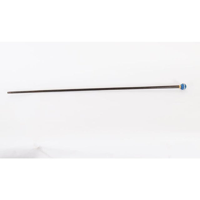 A Lapis Lazuli and rock crystal mounted walking cane, circa 1900, with a banded gold collar, stamped Briggs, with an ebony...