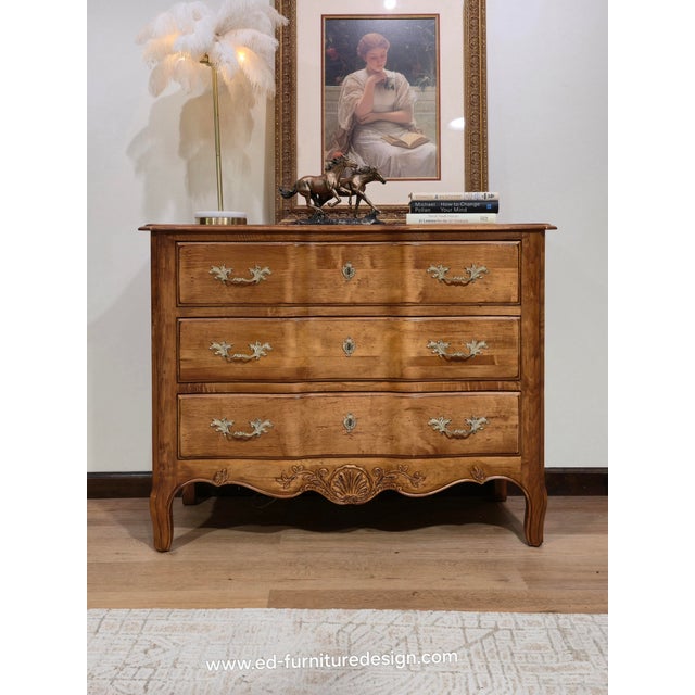 A beautifully crafted 1994-1997 Ethan Allen Legacy Collection French Provincial chest featuring an elegant serpentine...