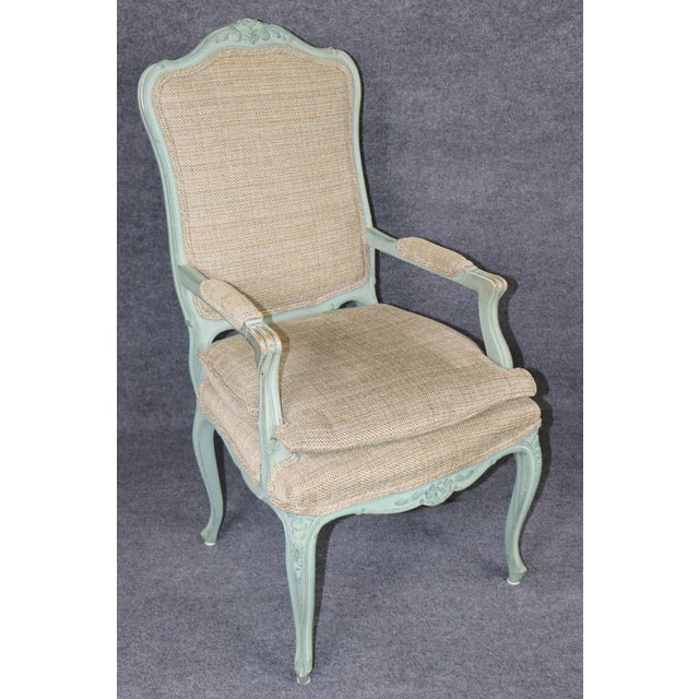 An exceptionally beautiful and charming **set of eight French Louis XV style chairs**, distinguished by their gracefully...