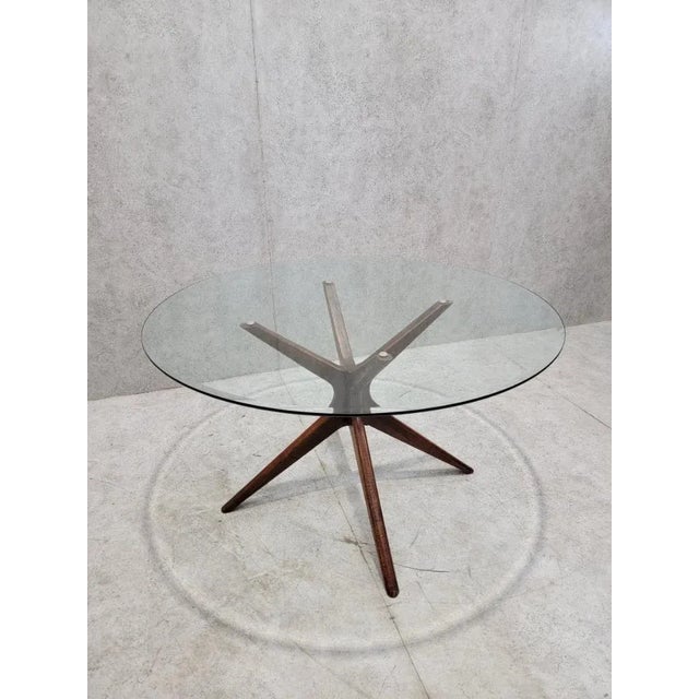 Mid-Century Modern Round Glass Dining Table with Sculptural Walnut Base A vintage Mid-Century Modern dining table...