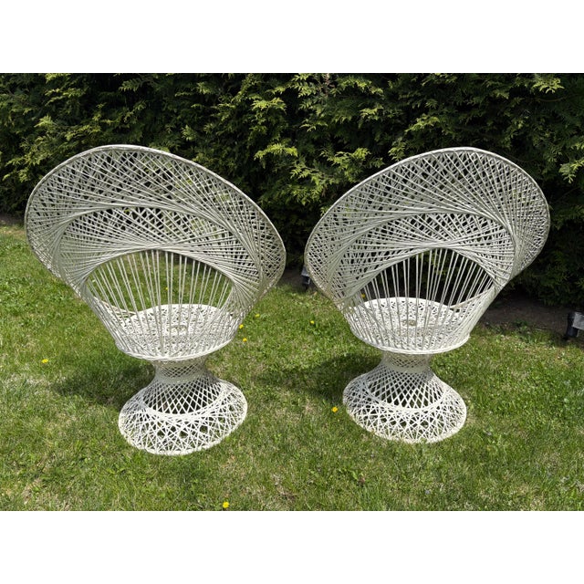 Mid century pair of white fiberglass outdoor /patio chairs. These are perfect for statement lounge chairs by the pool!...