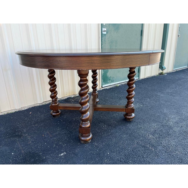 A newly refinished antique Quartersawn oak extension dining table. 54" round with a 10" leaf, this dining table is...