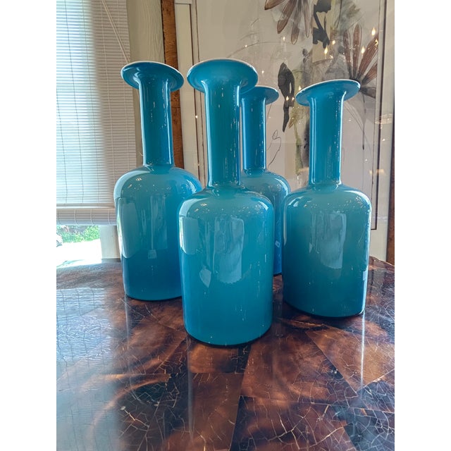Striking set of 4 turquoise glass modern vases having white interiors. Two large, two smaller. Larger are 14.5 h, 5.5...