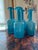Striking set of 4 turquoise glass modern vases having white interiors. Two large, two smaller. Larger are 14.5 h, 5.5...