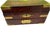 Antique box converted to a jewelry box. Top opens and drawer on front. Brass accents. Alice and Wonderland theme. 9" long...