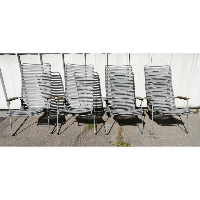 Set of 4 Lounge Chair Click System sun loungers. Metal frame, grey resin straps, and wooden armrests. In used condition....