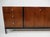 A stunning nine drawer dresser chest or credenza with walnut drawer fronts and ebony toned top and sides. The lower leg...