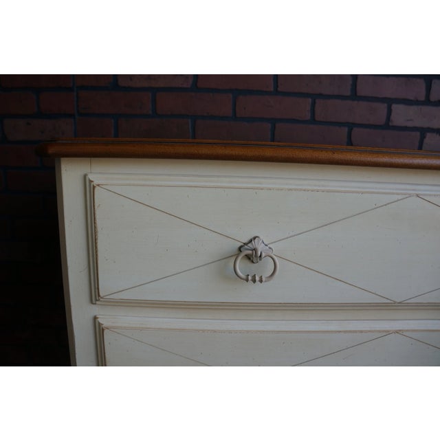 Gracefully curved apron, and Country French design motif offer a romantic "old world" feeling. Featuring two drawers with...