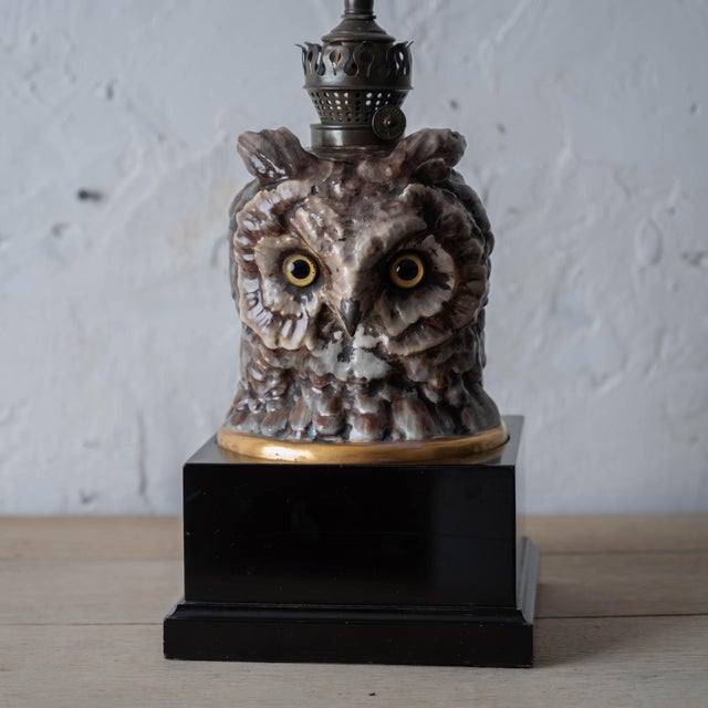 Porcelain owl bust oil lamp, circa 1880. Owl bust modeled with detailed feather texturing, mottled brown and white glazes,...