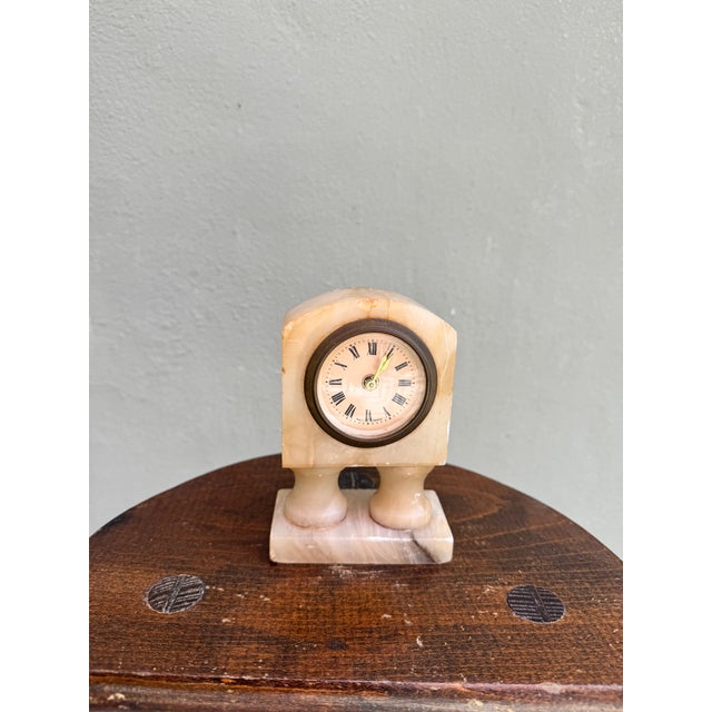 Straight out of a storybook — the kind of little clock you half expect to start talking to you. Carved from solid...