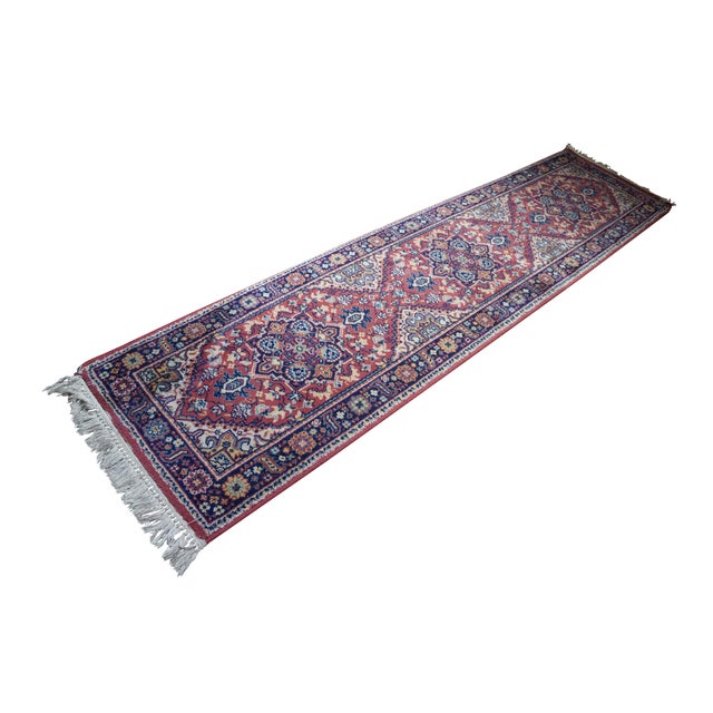 Vintage Kismet Oriental rug runner featuring a floral geometric star medallion design in red / , blue, green, yellow, and...