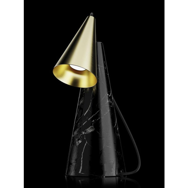 Table lamp with Marquinha black stone base and conic brushed brass lightshade. European Plug (up to 250V).