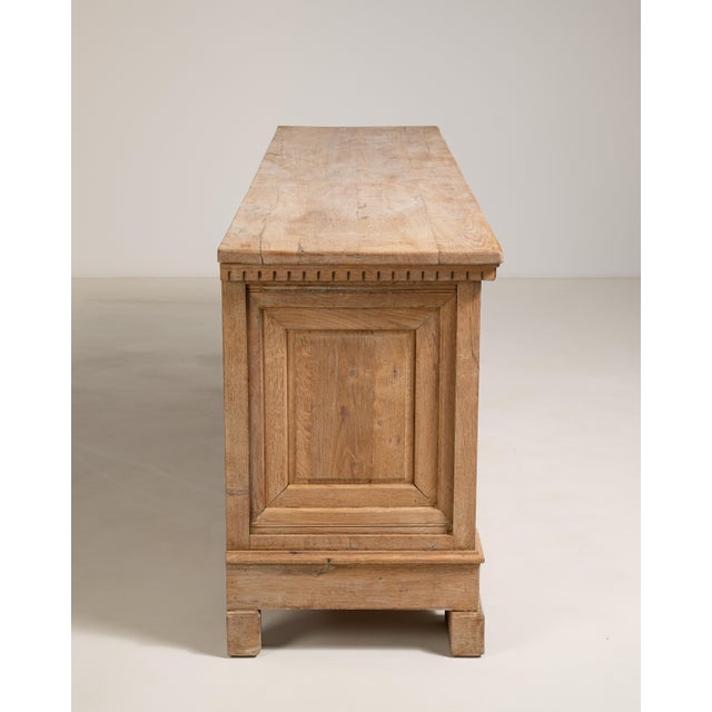Conceived in the spirit of Brutalist design that swept through French interiors in the 1970s, this exceptional oak buffet...