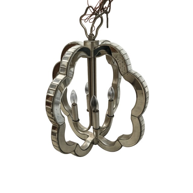 The Made Goods Fiona Lantern is a stunning statement lighting piece that brings sophistication and glamour to any space....