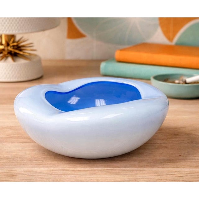 Beautiful Midcentury Glass Ashtray. This piece features a striking two-tone design, with a darker blue interior and a...