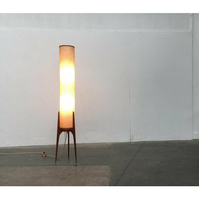 Elegant mid century rocket. This standing lamp convinces with its filigree details and the special materiality. The...