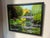 Original oil painting on canvas by Steve Schaaf featuring a tranquil garden pond filled with blooming water lilies,...