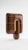 The smallest lamp in the collection, and often the first one people reach for. Its folded form hides the source entirely,...