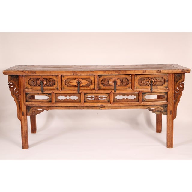Chinese elm wood sideboard, circa 1950's. With a rectangular top, 4 frieze drawers with iron drawer pulls, resting on...