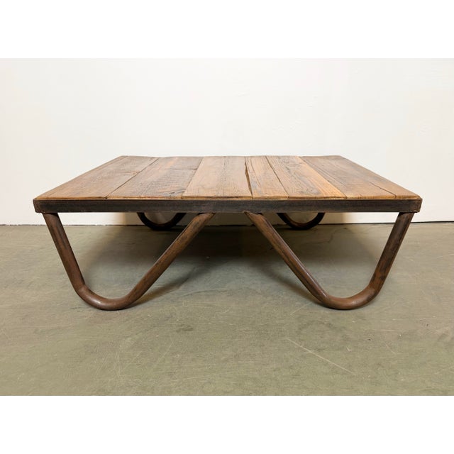 - Vintage Industrial coffee table manufactured in the 1960s - Made of solid wood and iron - Weight of the table is 18 kg.