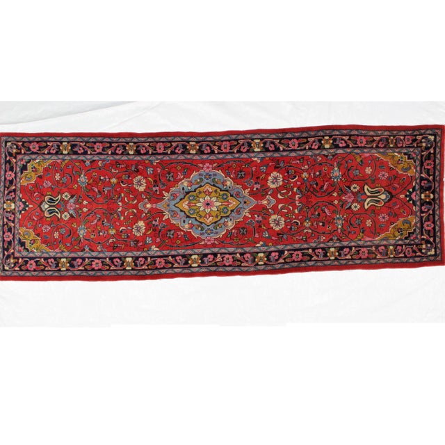 Wool pile genuine hand woven very fine vintage Persian Sarouk runner in excellent condition. The piece was made in the 1970s.