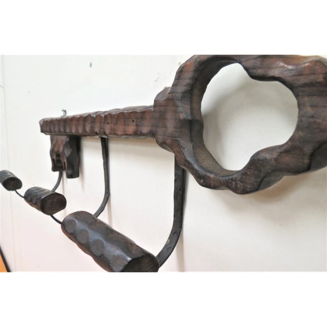 This is a neat antique oak hat rack imported from France. It is shaped like a skeleton key and has room for 3 hats. It is...