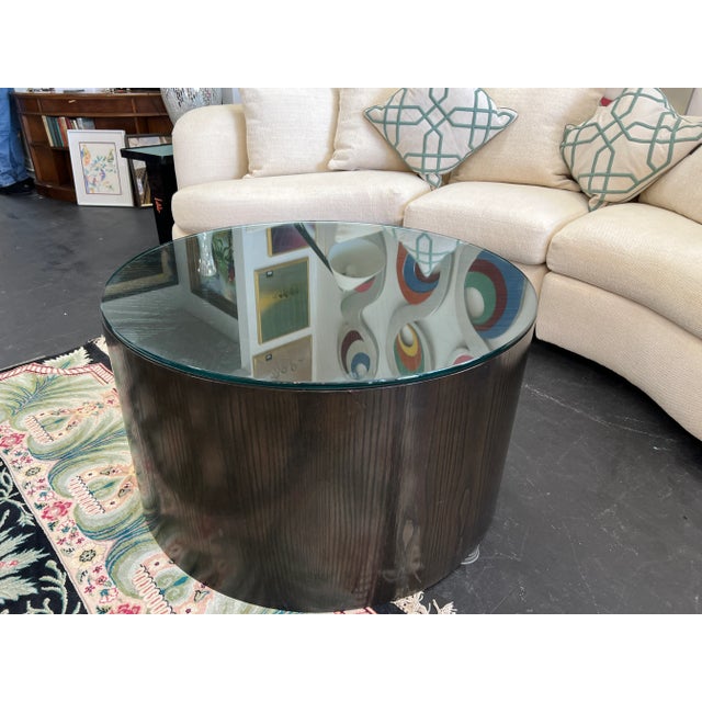 This cylindrical coffee/cocktail table embodies a modern minimalist design with clean lines and streamlined form. The base...