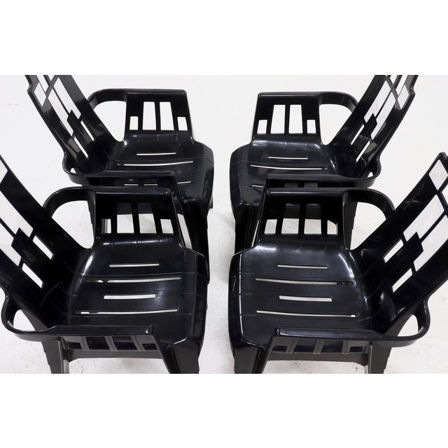 Set of 4 Boston outdoor dining chairs designed by Pierre Paulin for Henry Massonnet in the 1980s. The chairs are for...