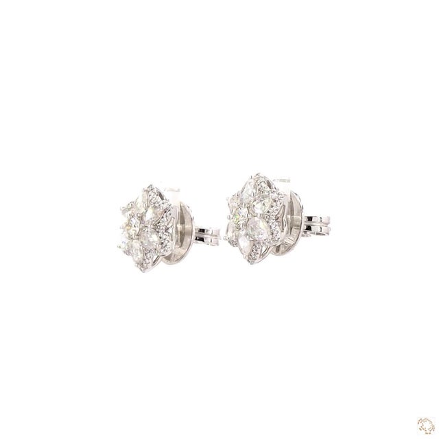 This pair of estate earrings from our contemporary estate collection centers on a 0.54-carat diamond. It is framed by...