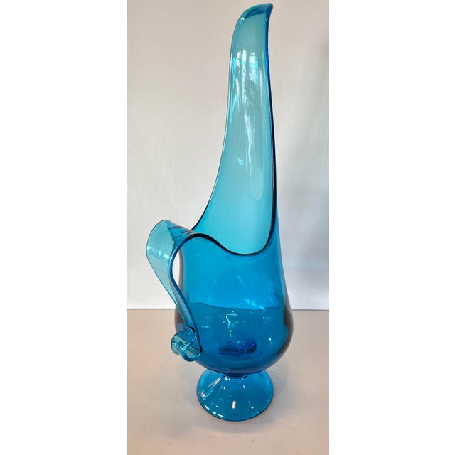 Stunning, mid century pitcher in rarest size, 18" tall. Add to your swung glass collection with this striking and...