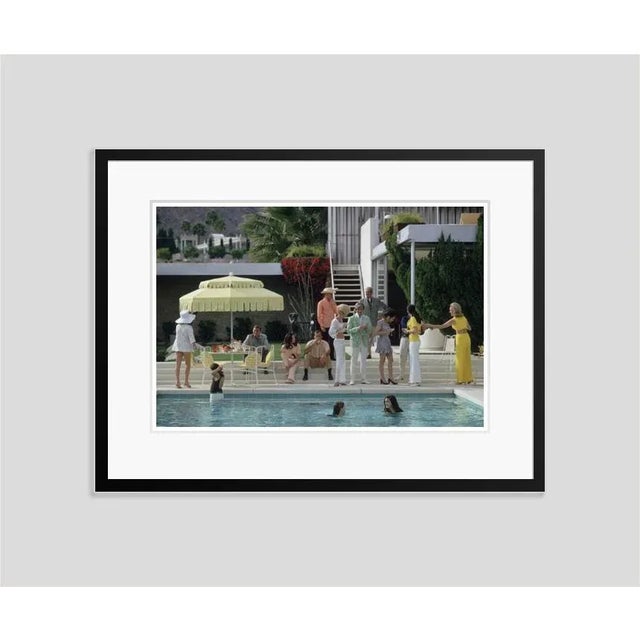 Poolside gathering' by slim aarons open edition january 1970: the kaufmann desert house in palm springs, california,...