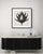 A striking black-and-white botanical print featuring Anastatica Hierochuntina, meticulously restored and remastered from...