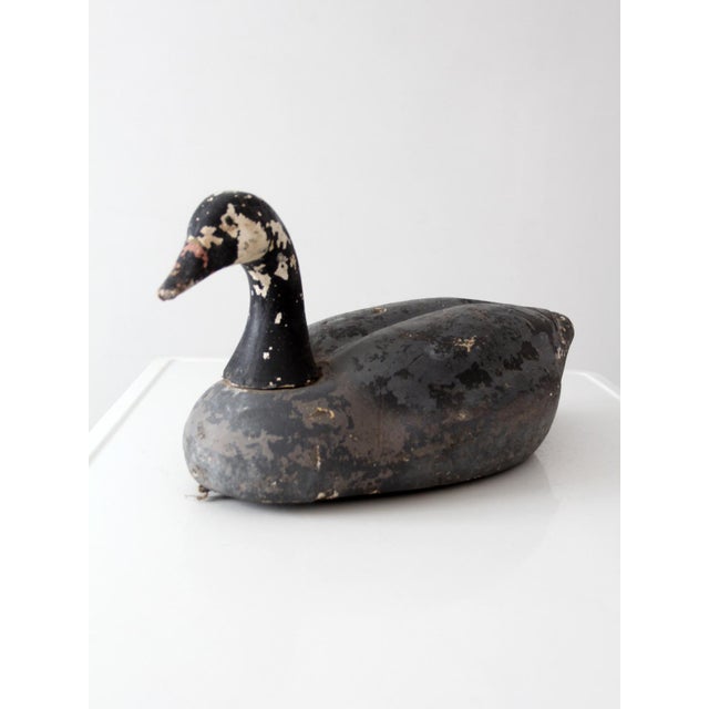 This late 19th-century wooden boat oar showcases a beautifully weathered surface with remnants of aged green paint and...