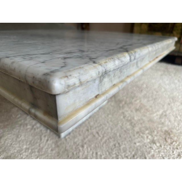 This sculptural marble coffee table was custom-made in the 1970s and is a unique piece characterized by its strong...