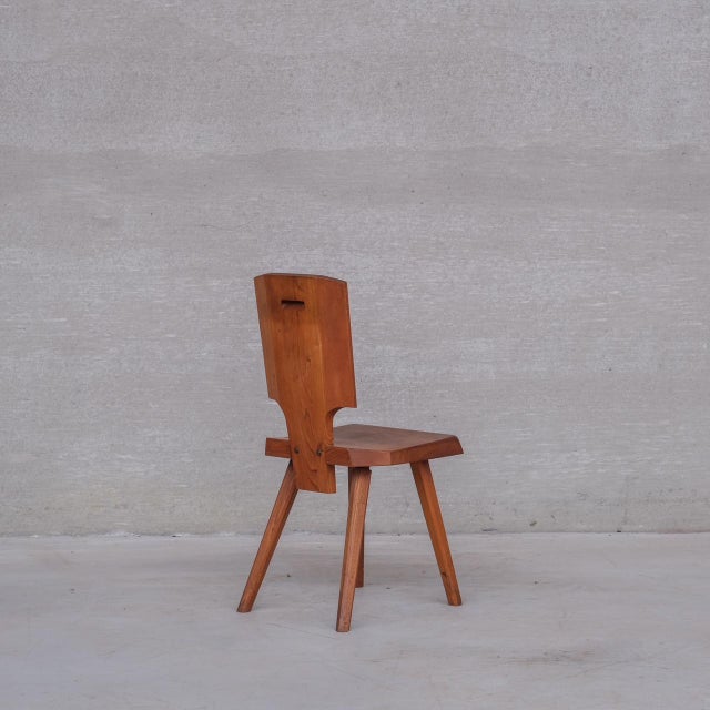 A set of eight elm dining chairs by pierre chapo. france, c1974. s28 model. increasingly scarce as chapo's stature in the...