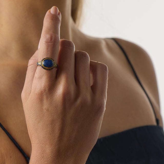 This beautiful vintage sapphire ring is a striking 1980’s design, centered by a cabochon cut sapphire weighing...