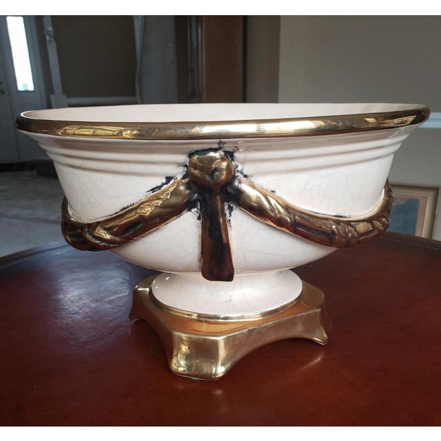 Elegant Ivory and gold porcelain centerpiece / bowl with rich gilt porcelain swag accents. Perfect to fill with fruit or...