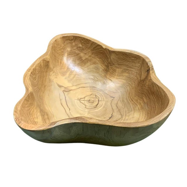 This teak live edge bowl is a unique piece showcasing the natural beauty of teak wood. Crafted by skilled artisans, its...