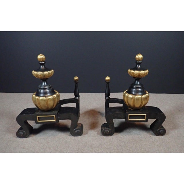 Unusual pair of chenets, Regency style gilt bronze and iron. Pair of fine quality, unusual chenets/andirons. Of bulbus...
