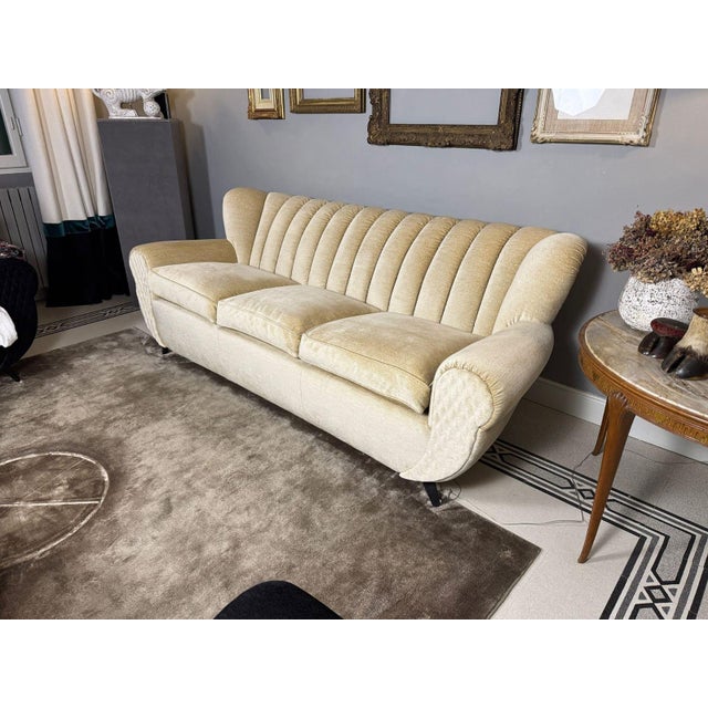 This sofa was reupholstered 15 years ago and in the inner wooden frame the manufacturer wrote 1953 , definitely a...