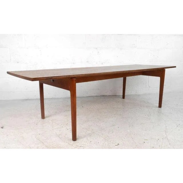 This beautiful Andreas Tuck coffee table features the wonderful design of Hans Wegner. Complete with trademark signet, and...