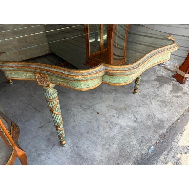 This Antique Style Italian Baroque Venetian Aged Glass Top Dining Table is a luxurious and elegant piece of furniture for...