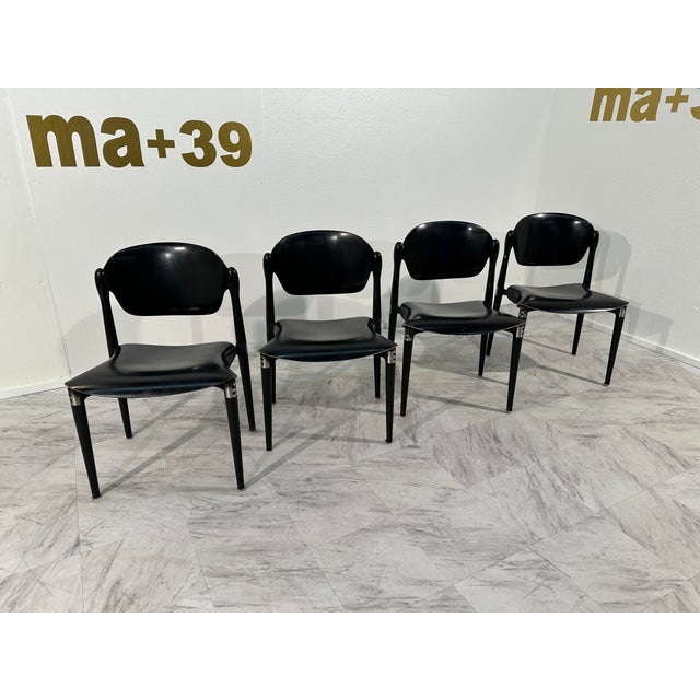 Set of 4 rosewood and black lacquered "S83" side chairs by Eugenio Gerli for Tecno, Italy, 1962 A compact and comfortable...