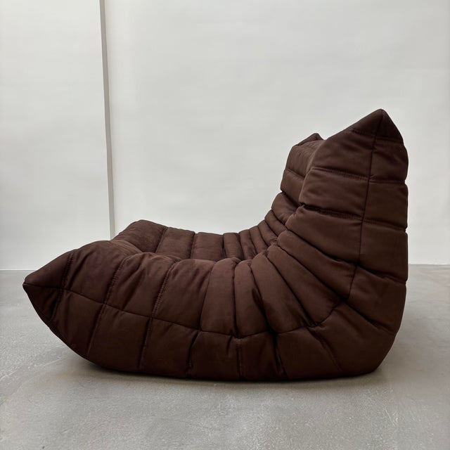 Armchair by Michel Ducaroy for Ligne Roset, reupholstered in brown suede-textured fabric. The original cover will be...