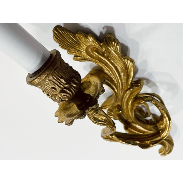 It is confirmed that Art Deco French single arm wall sconce is of gilt bronze and fabulous. Pair of Candle light would...